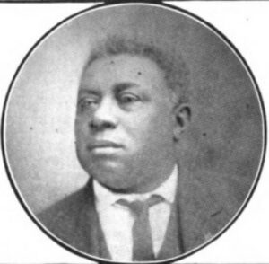 photo of Black man with tie in circle frame
