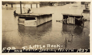 houses in flood wate rwith people on roof