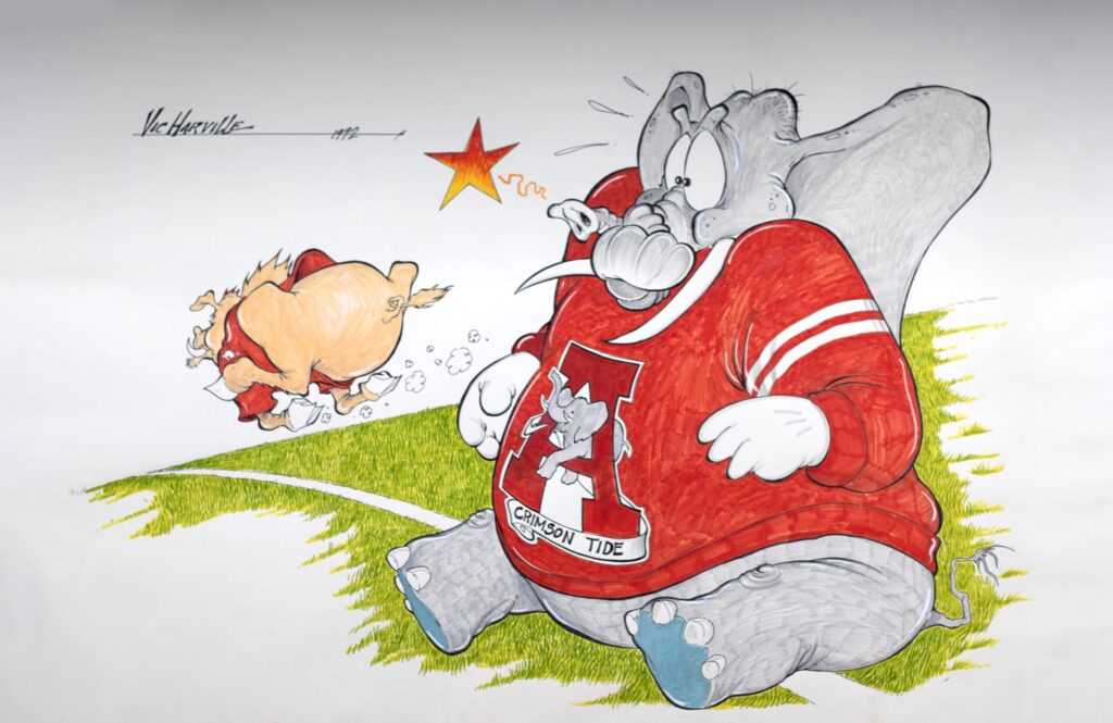 image of a hog running away from an elephant in an Alabama jersey
