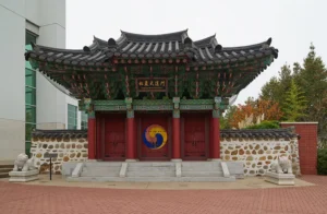 color photograph of a Korean style gate in a downtown city center