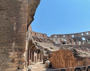 ruins of a colosseum under a blue sky
