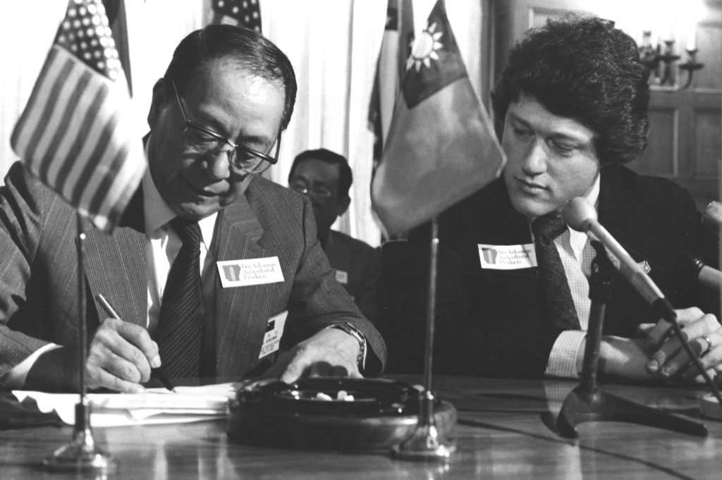 Governor Bill Clinton signing trade agreement with Taiwanese official, 1979.