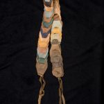 Belt of interwoven pieces of leather tied at the ends