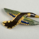 Wooden lacquer pin of a mallard in flight