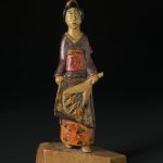 Small wooden statue of a Japanese woman