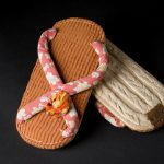 Pair of leather Geta sandals of orange and beige leather pieces