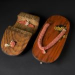 Pair of wooden lacquered Geta sandals and a thong made of cotton fabric