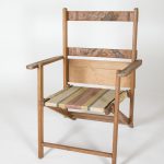 Wooden folding chair with an etching of a cherry blossom tree