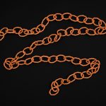 Belt made from orange electrical wire bent into rings and linked