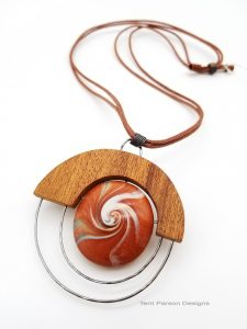 Necklace with wood stone and wire pendant