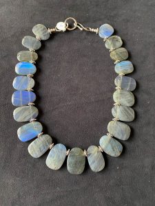 Necklace with blue stones on display