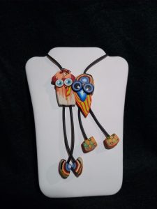 Multicolored squid necklace on display