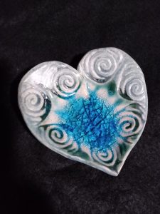 Spirals engraved on ceramic heart