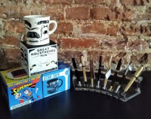 Novelty coffee mugs and pens on display