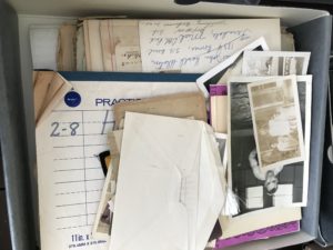 Box of old papers and photographs