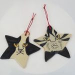 Cat faces on star shaped Christmas tree ornaments