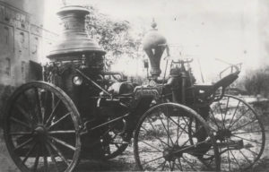 old style vehicle with spoked wheels and steam vessels