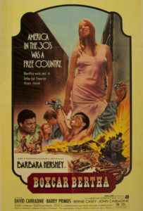 movie poster with woman in pink dress and a train explosion