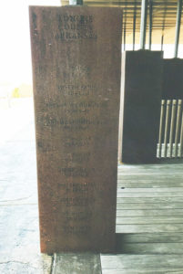 rectangular standing memorial with names engraved on it
