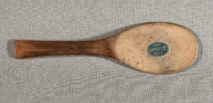 brown wooden spoon lying flat