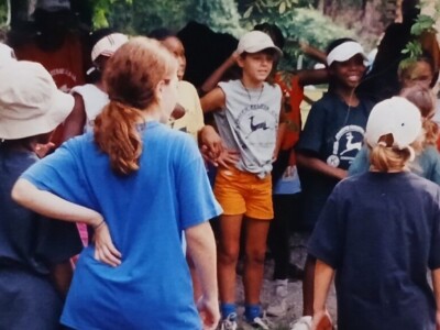 African American and white children mostly wearing hats standing in a group